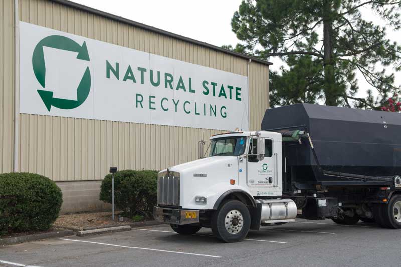 Truck with compactor box at Natural State Recycling
